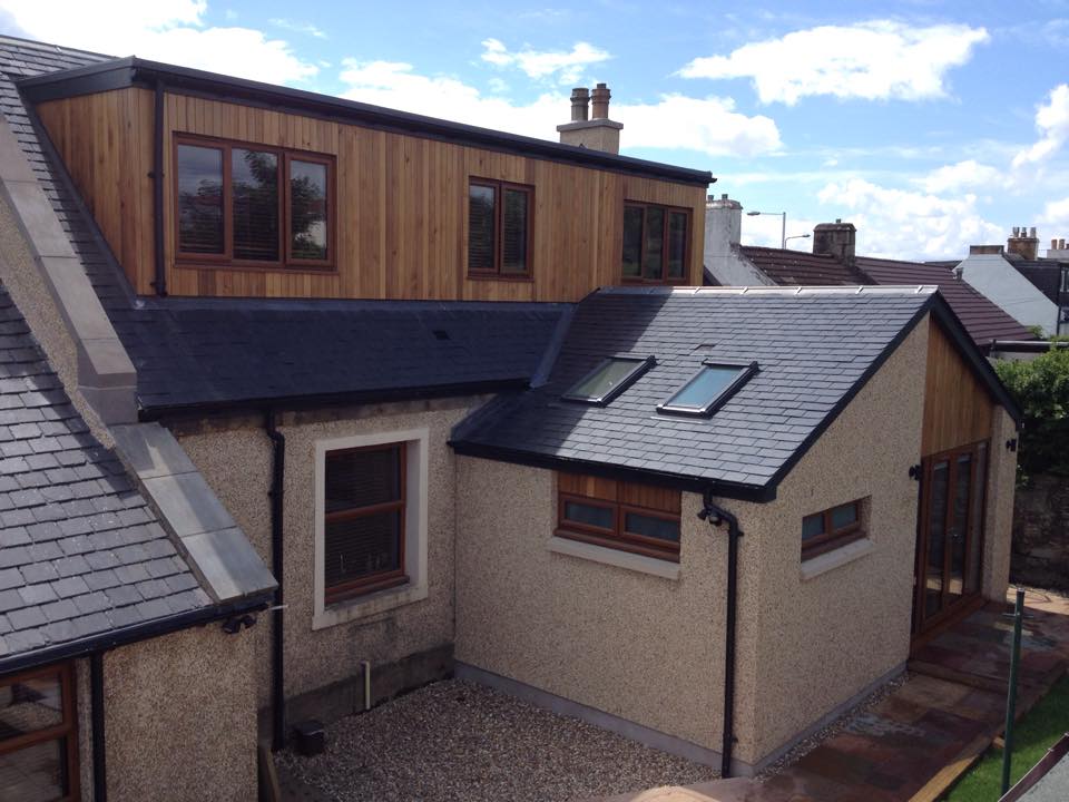 large flat roof dormer with cedar clad finish